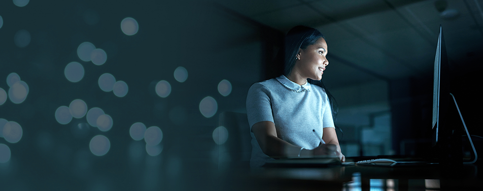 Computer, design or dedication with a female employee working on a project in the evening.